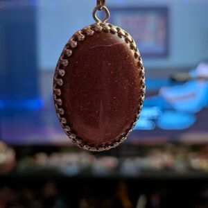 Warm Autumn Vibe Goldstone Pendant in Intricate Setting